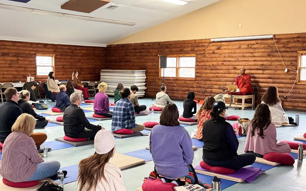 Buddhist monk teaching meditation techniques during a meditation retreat